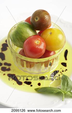 Close-up of vegetables in bowl with oil on platter View Large Photo Image Stock Photograph - Close-up of vegetables in bowl with oil on platter . Fotosearch