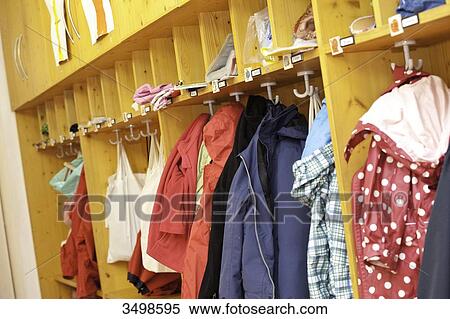Clothes hanging in the cloakroom of a kindergarten View Large Photo Image Stock Photography - Clothes hanging in the cloakroom of a kindergarten . Fotosearch
