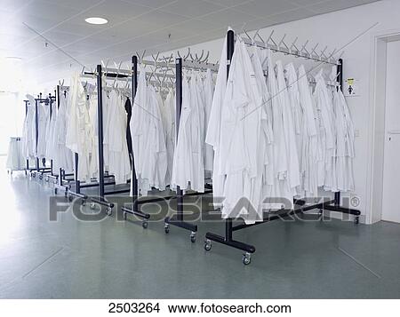Picture - Clothes hanging on hangers . Fotosearch