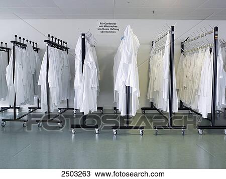 Clothes hanging on hangers View Large Photo Image Stock Image - Clothes hanging on hangers . Fotosearch