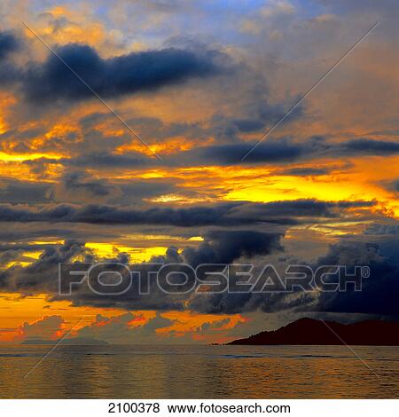 Clouds over sea at sunset View Large Photo Image Stock Photo - Clouds over sea at sunset . Fotosearch