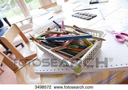 Coloured pencils in a basket on a table, elevated view View Large Photo Image Stock Image - Coloured pencils in a basket on a table, elevated view . Fotosearch