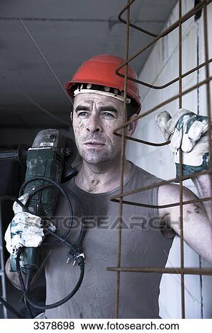 Stock Photo - Construction worker on a construction site . Fotosearch