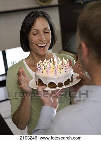 Stock Photograph - Couple celebrating birthday . Fotosearch
