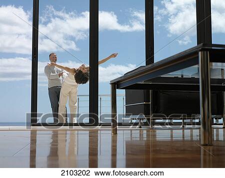 Couple dancing in balcony View Large Photo Image Stock Image - Couple dancing in balcony . Fotosearch