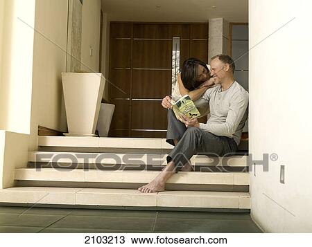 Couple romancing on steps View Large Photo Image Stock Image - Couple romancing on steps . Fotosearch
