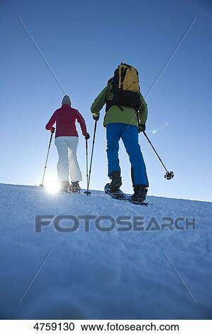 Couple snow hiking, Tannheimer Tal, Tyrol, Austria View Large Photo Image Stock Image - Couple snow hiking, Tannheimer Tal, Tyrol, Austria . Fotosearch