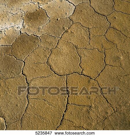 Cracked earth View Large Photo Image Stock Photo - Cracked earth . Fotosearch