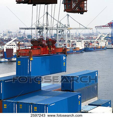 Crane hoisting container at harbor View Large Photo Image Stock Image - Crane hoisting container at harbor . Fotosearch