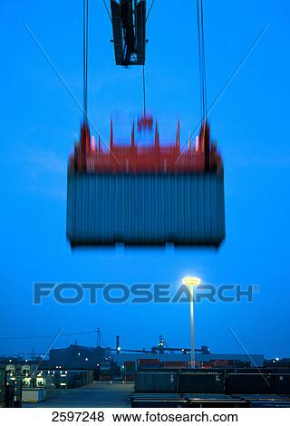 Crane hoisting container at harbor, Hamburg, Germany View Large Photo Image Stock Photo - Crane hoisting container at harbor, Hamburg, Germany . Fotosearch