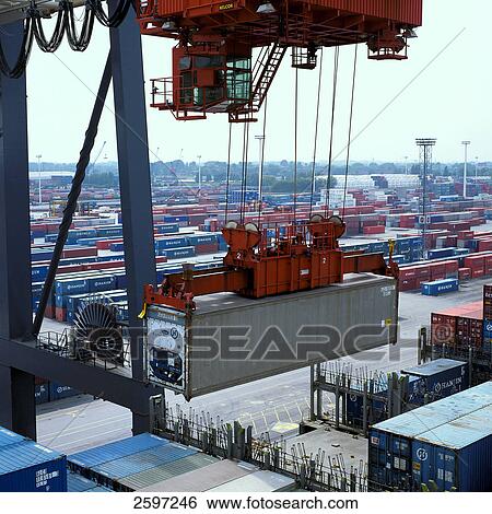 Crane hoisting container at harbor, Hamburg, Germany View Large Photo Image Stock Photograph - Crane hoisting container at harbor, Hamburg, Germany . Fotosearch
