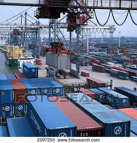 Crane hoisting container at harbor, Hamburg, Germany View Large Photo Image Stock Photography - Crane hoisting container at harbor, Hamburg, Germany . Fotosearch