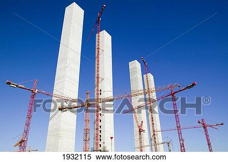 Stock Photography - Cranes at construction site . Fotosearch