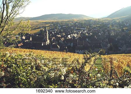Cultivated field in front of town View Large Photo Image Stock Image - Cultivated field in front of town . Fotosearch