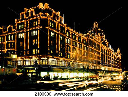 Department store lit up at night, Harrods, London, England View Large Photo Image Stock Image - Department store lit up at night, Harrods, London, England . Fotosearch