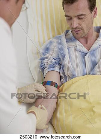 Doctor injecting on patient's arm View Large Photo Image Stock Image - Doctor injecting on patient's arm . Fotosearch