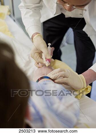 Doctor injecting on patient's arm View Large Photo Image Stock Image - Doctor injecting on patient's arm . Fotosearch