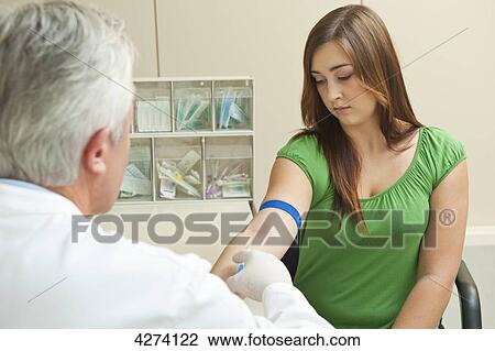 Doctor taking patient's blood sample View Large Photo Image Stock Image - Doctor taking patient's blood sample . Fotosearch