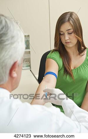 Doctor taking patient's blood sample View Large Photo Image Stock Image - Doctor taking patient's blood sample . Fotosearch