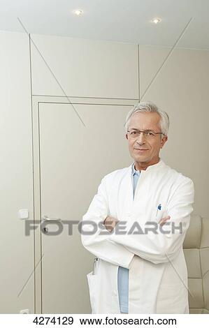 Doctor with arms folded View Large Photo Image Stock Photo - Doctor with arms folded . Fotosearch