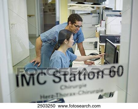 Doctors working in hospital View Large Photo Image Stock Image - Doctors working in hospital . Fotosearch