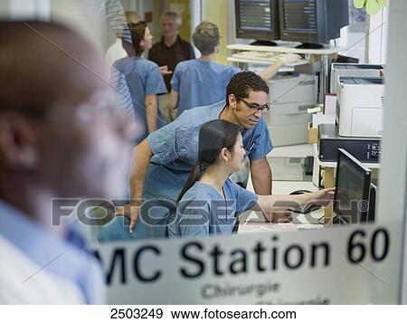 Doctors working in hospital View Large Photo Image Stock Photo - Doctors working in hospital . Fotosearch