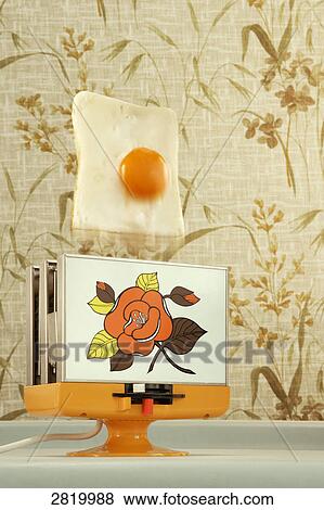 Egg toast popping up from toaster View Large Photo Image Stock Photo - Egg toast popping up from toaster . Fotosearch