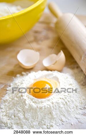 Egg yolk in flour View Large Photo Image Stock Photo - Egg yolk in flour . Fotosearch