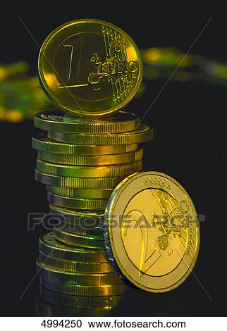 Stock Image - European coins in coloured light . Fotosearch
