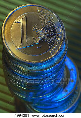 Stock Image - European coins in coloured light . Fotosearch