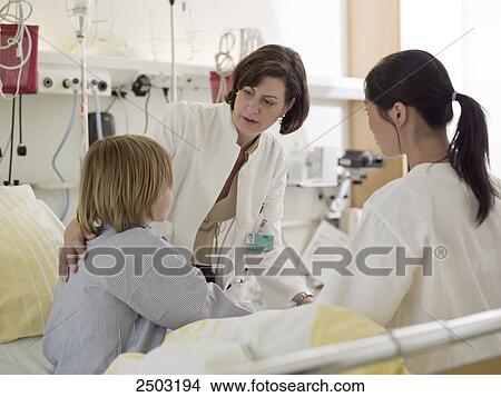 Picture - Female doctor examining patient . Fotosearch
