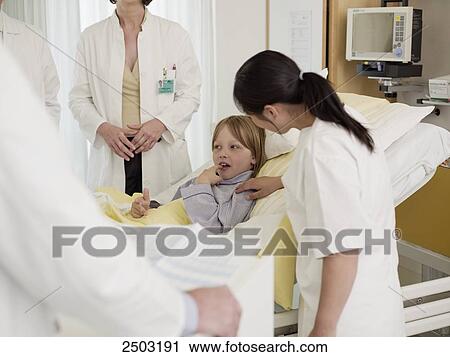 Female doctor examining patient View Large Photo Image Stock Image - Female doctor examining patient . Fotosearch