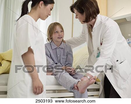 Female doctor examining patient View Large Photo Image Stock Image - Female doctor examining patient . Fotosearch