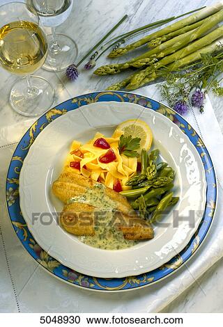 fillet of fish with fettucines and asparagus spears View Large Photo Image Stock Image - fillet of fish with fettucines and asparagus spears . Fotosearch