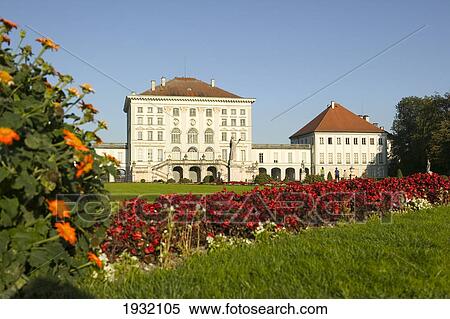 Flowers blooming in garden in front of building View Large Photo Image Stock Photography - Flowers blooming in garden in front of building . Fotosearch