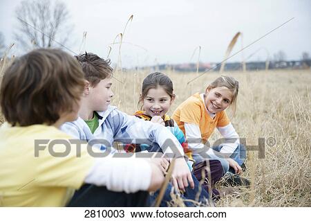 Friends enjoying in forest View Large Photo Image Stock Image - Friends enjoying in forest . Fotosearch