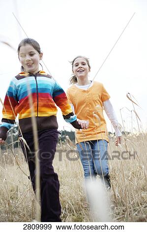 Stock Photo - Friends enjoying in forest . Fotosearch