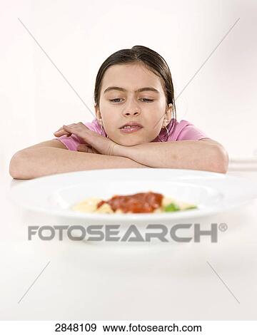 Stock Photo - Girl disliking food . Fotosearch