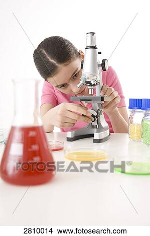 Girl doing experiment in chemistry laboratory View Large Photo Image Picture - Girl doing experiment in chemistry laboratory . Fotosearch