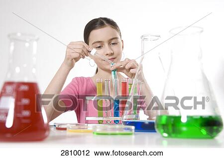 Girl doing experiment in chemistry laboratory View Large Photo Image Stock Image - Girl doing experiment in chemistry laboratory . Fotosearch