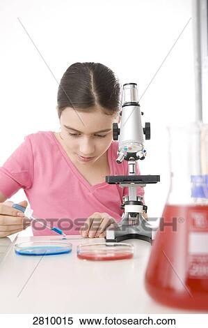 Girl doing experiment in chemistry laboratory View Large Photo Image Stock Photography - Girl doing experiment in chemistry laboratory . Fotosearch