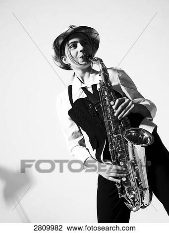 Girl playing saxophone View Large Photo Image Stock Image - Girl playing saxophone . Fotosearch