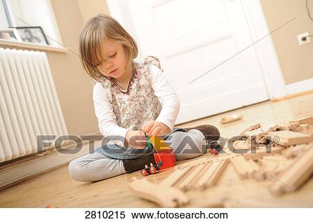 Girl playing with blocks View Large Photo Image Stock Photography - Girl playing with blocks . Fotosearch