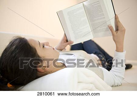 Stock Image - Girl reading book . Fotosearch