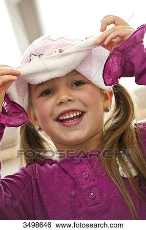 Girl with towel on her head View Large Photo Image Stock Photograph - Girl with towel on her head . Fotosearch