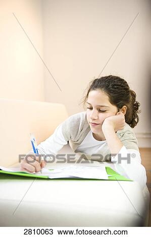 Girl writing on sheet of paper View Large Photo Image Stock Image - Girl writing on sheet of paper . Fotosearch