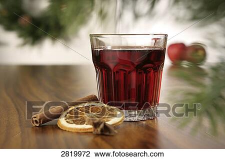 Glass of mulled wine with cinnamon stick and slice of orange View Large Photo Image Stock Image - Glass of mulled wine with cinnamon stick and slice of orange . Fotosearch