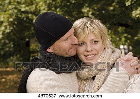 Happy couple embracing outdoors View Large Photo Image Stock Photo - Happy couple embracing outdoors . Fotosearch