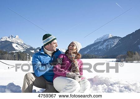 Happy couple in winter landscape, Tannheimer Tal, Tyrol, Austria View Large Photo Image Stock Photo - Happy couple in winter landscape, Tannheimer Tal, Tyrol, Austria . Fotosearch