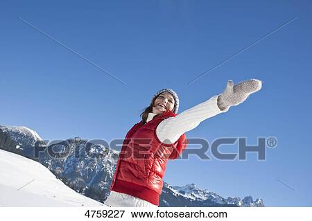 Happy woman in winter landscape, Tannheimer Tal, Tyrol, Austria View Large Photo Image Stock Photo - Happy woman in winter landscape, Tannheimer Tal, Tyrol, Austria . Fotosearch